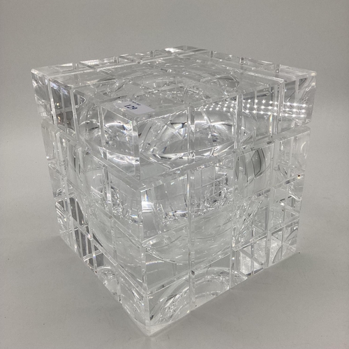 A stylistic cubed ice bucket, with hinged lid, opening to reveal glass ...