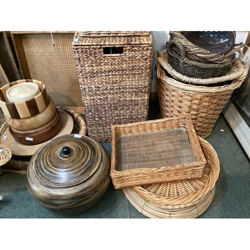 130 - A good large quantity of modern basket wares and wooden wares, to include laundry baskets, bread bas... 