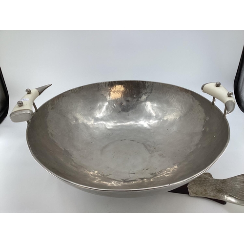 134 - A very large beaten metal style bowl, and a large board styled with fish head and fins