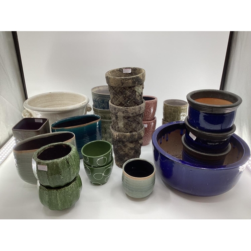 137 - A quantity of decorative flower pots, planters all modern, as found