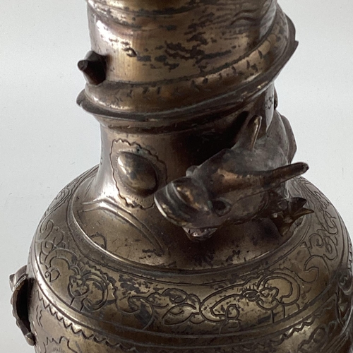 142 - A pair of bronze effect baluster vases, with cast dragon decoration, 25cm high, and a bronze ewer wi... 