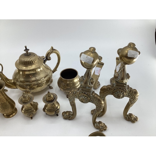 149 - A quantity of brassware's including brass fire irons, pots, small kettles, trinkets etc