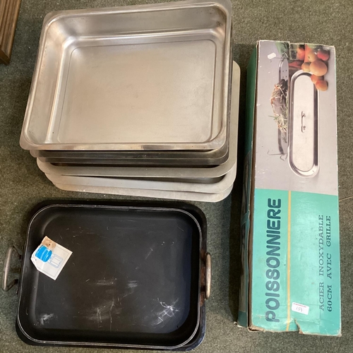 154 - Quantity of Aga and Aga style oven pans, and a fish kettle