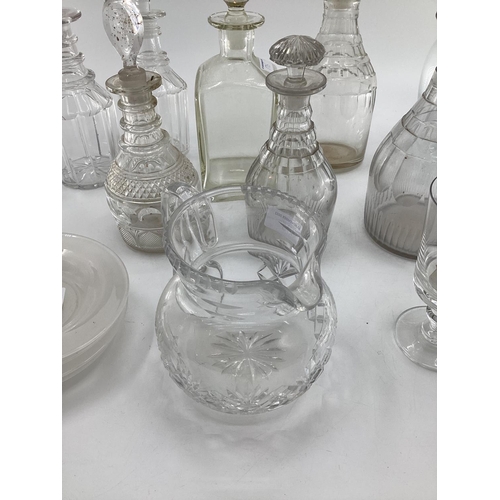 175 - Quantity of decanters, pair of claret jugs, and a frosted glass small corked vase, engraved Harringt... 