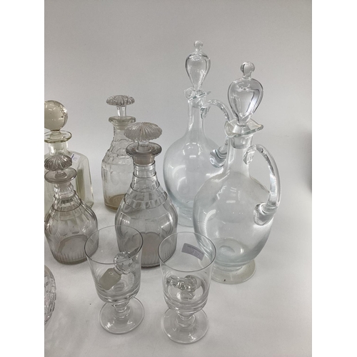 175 - Quantity of decanters, pair of claret jugs, and a frosted glass small corked vase, engraved Harringt... 