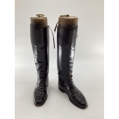 189 - Two pairs of black ladies leather hunting boots by Rowell and Sons, Melton Mowbray both with wooden ... 