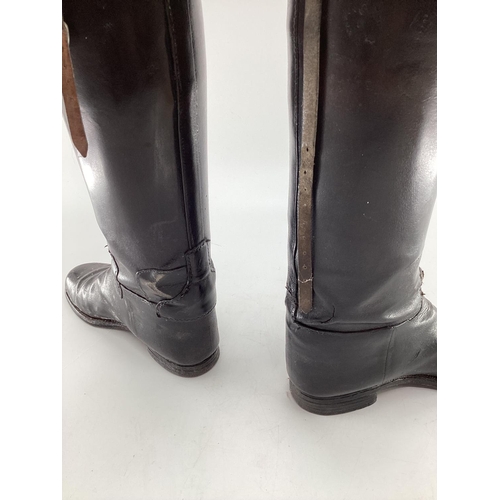 189 - Two pairs of black ladies leather hunting boots by Rowell and Sons, Melton Mowbray both with wooden ... 