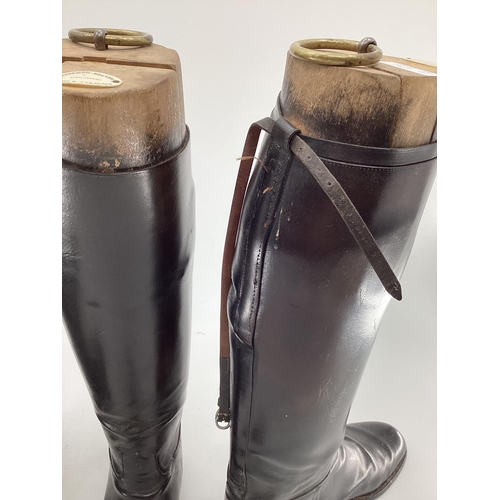 189 - Two pairs of black ladies leather hunting boots by Rowell and Sons, Melton Mowbray both with wooden ... 