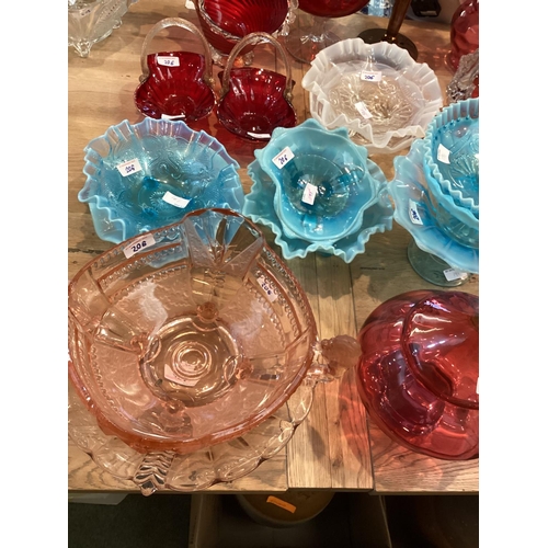 206 - A  quantity of coloured glass to include: pair of cranberry glass decorative baskets with rope twist... 