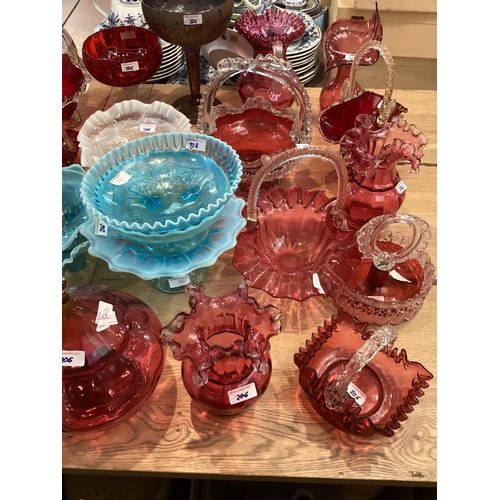 206 - A  quantity of coloured glass to include: pair of cranberry glass decorative baskets with rope twist... 