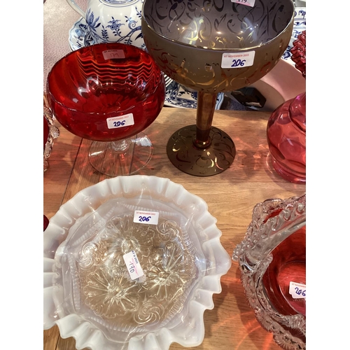 206 - A  quantity of coloured glass to include: pair of cranberry glass decorative baskets with rope twist... 