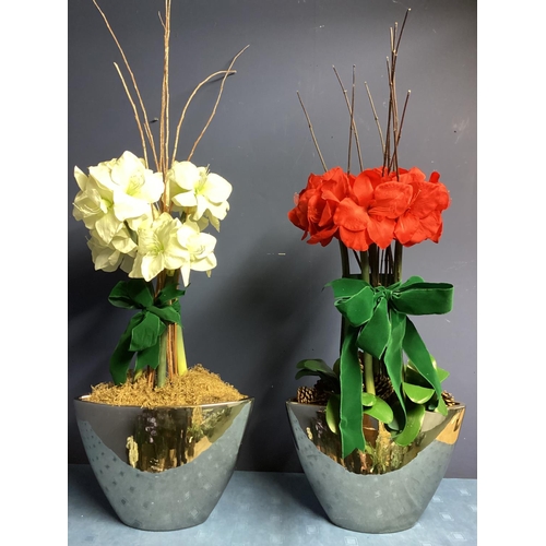 219 - Two faux flower arrangements, a white and red amaryllis, in contemporary mirrored oval planters, set... 