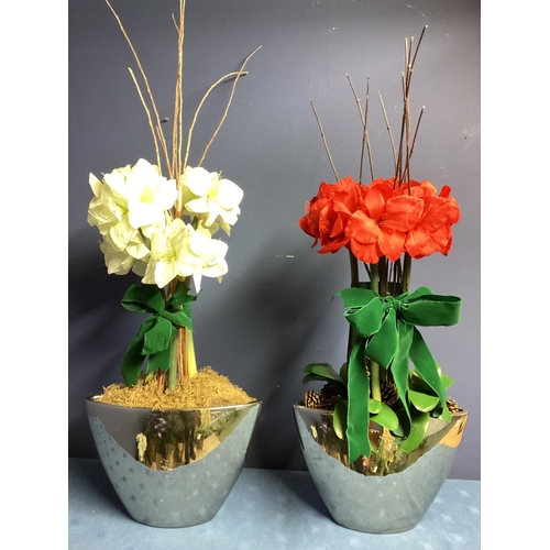 219 - Two faux flower arrangements, a white and red amaryllis, in contemporary mirrored oval planters, set... 