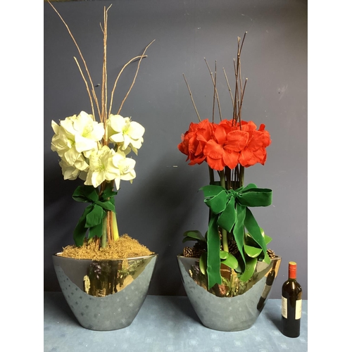 219 - Two faux flower arrangements, a white and red amaryllis, in contemporary mirrored oval planters, set... 