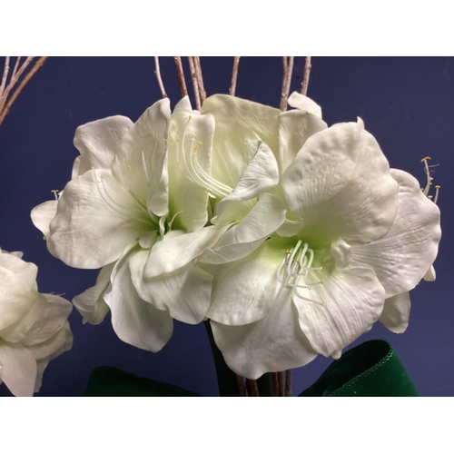 220 - Three faux flower arrangements,  white amaryllis, in contemporary  circular mirrored planters, set w... 