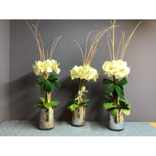 220 - Three faux flower arrangements,  white amaryllis, in contemporary  circular mirrored planters, set w... 