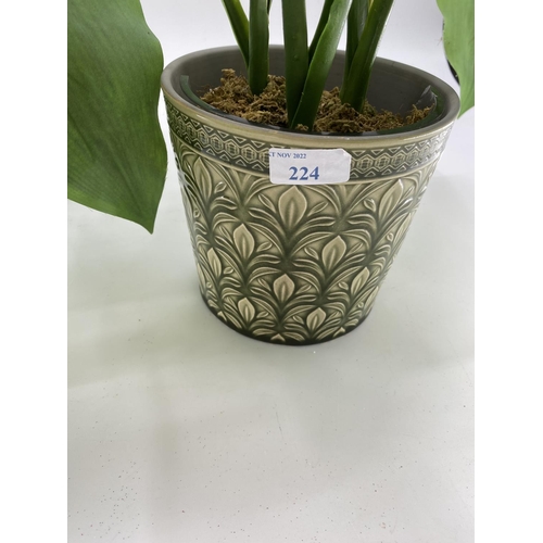 224 - Pair of decorative faux flowers, tall white arrangements in planter, with tall green foliage