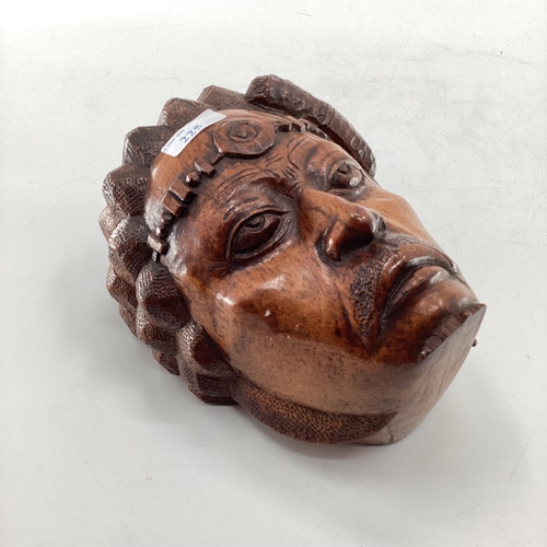 225 - A C20th hardwood carving of a native head, believed to be Madagascan, signed verso, J Rasoamanana