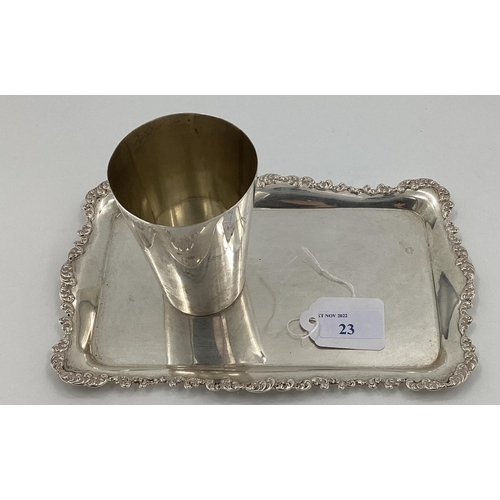 23 - A Victorian sterling silver beaker together with a small oblong silver card tray with cast scrolling... 