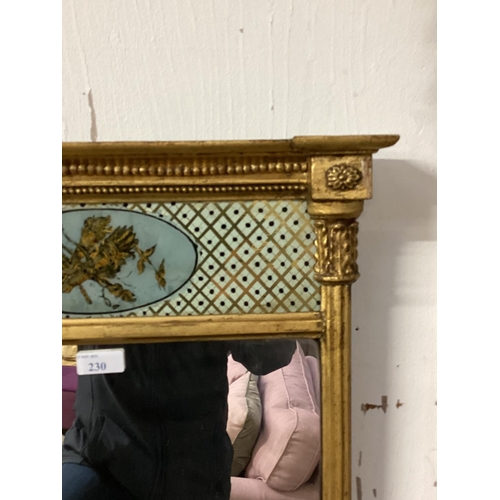 230 - A Georgian gilt pier mirror, rectangular plate with twin column support frame, topped by inset ename... 