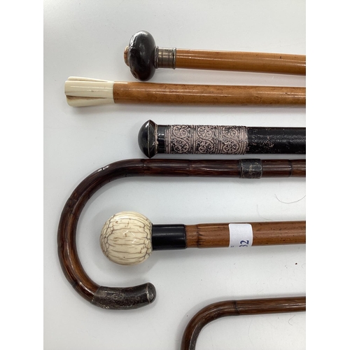 232 - A quantity of walking canes and swagger sticks