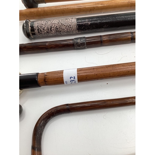 232 - A quantity of walking canes and swagger sticks