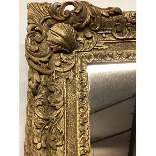 238 - A carved giltwood mirror, rectangular plate with carved floral frame, 83 x 66cm