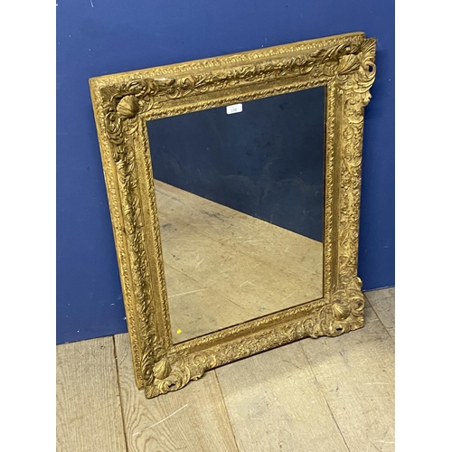 238 - A carved giltwood mirror, rectangular plate with carved floral frame, 83 x 66cm