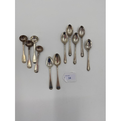 24 - A collection of sterling silver tea spoons and a set of four Georgian mustard spoons, 142g AND A col... 