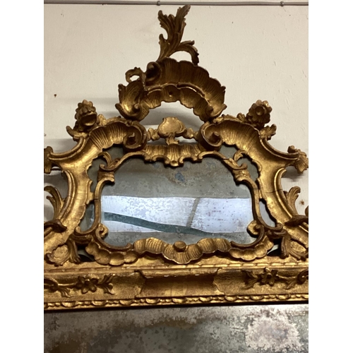 245 - A George III giltwood carved mirror, pierced scrolling top with mirror cartouche, rectangular plate ... 