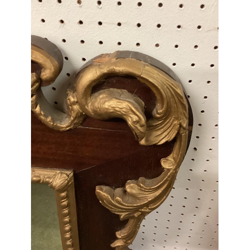 246 - A Georgian style gilt and mahogany overmantel mirror, spread eagle crest over rectangular plate, 130... 