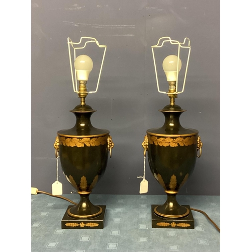 253 - Pair of black and gold lamps, on stepped base, with lion mask handles,  in the classical Grand Tour ... 