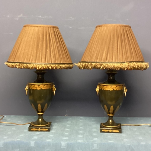 253 - Pair of black and gold lamps, on stepped base, with lion mask handles,  in the classical Grand Tour ... 