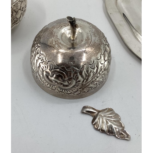 27 - A small Egyptian silver lidded bowl together with a set of four silver plated dishes and one smaller... 