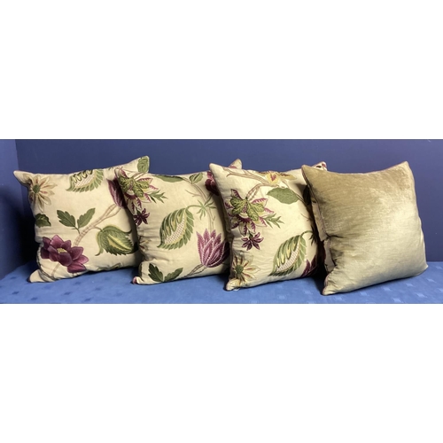 270 - A set of four bespoke good silk and velvet cushions, decorated cream ground and purple and green fol... 