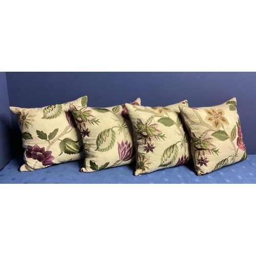 270 - A set of four bespoke good silk and velvet cushions, decorated cream ground and purple and green fol... 