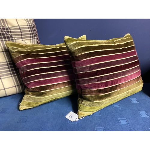 276 - Eight cushions, 2 small purple velvet, 4 small velvet and moss green striped, and 2 purple and cream... 