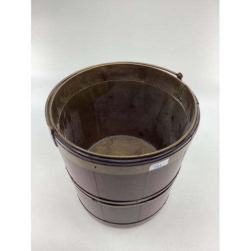 284 - A good mahogany and brass bound bucket, wit brass liner and carrying handle, 32cm H