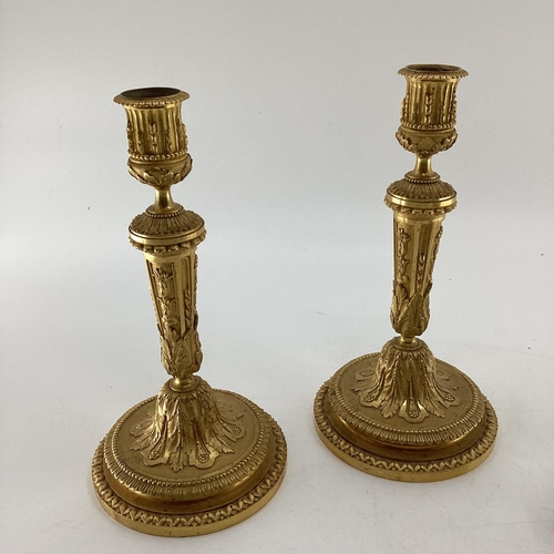 286 - Pair of ornte gilded candlesticks 26cmH, and a pair of wall sconces, and a small/mini metal easel