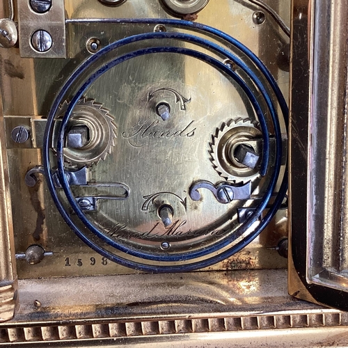 287 - A gilt brass carriage clock, with five glass panels, striking on a gong.