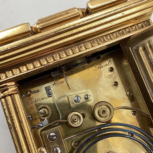 287 - A gilt brass carriage clock, with five glass panels, striking on a gong.