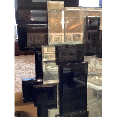 300 - 2 modern mirrors: A large C20th overmantel mirror, rectangular bevelled plate with geometric glass f... 