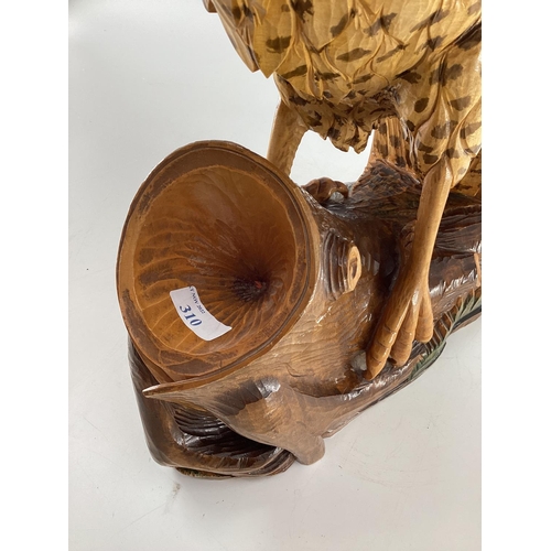 310 - A wooden and resin model of a swooping Eagle on a tree stump (wing detachable) 74 cm x 75 cm x 32 cm