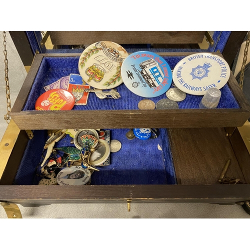 311 - A large collection of C20th collectable and school badges in a brass bound casket with two compacts