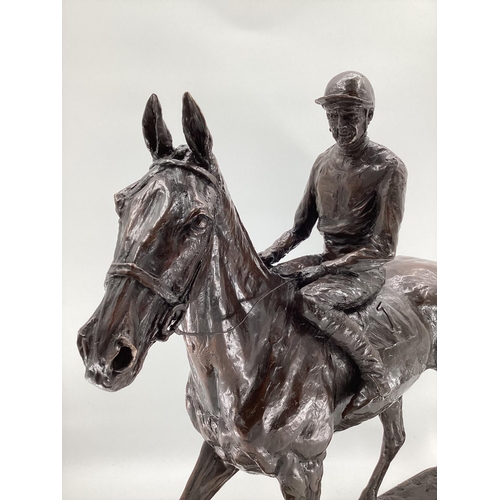 315 - EMMA MACDERMOTT: A superb large patinated bronze figure of ARKLE AND PAT TAAFE; mounted on a polishe... 