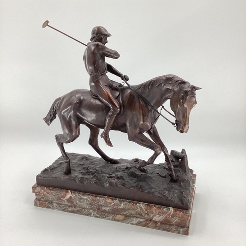 316 - JOSEPH CUVELIER (1833-1870) A patinated bronze figure of a polo player c 1866, mounted on a marble b... 