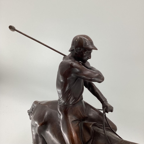 316 - JOSEPH CUVELIER (1833-1870) A patinated bronze figure of a polo player c 1866, mounted on a marble b... 