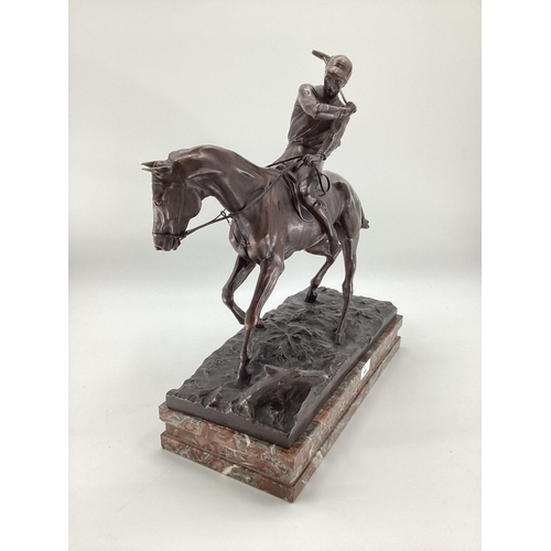 316 - JOSEPH CUVELIER (1833-1870) A patinated bronze figure of a polo player c 1866, mounted on a marble b... 