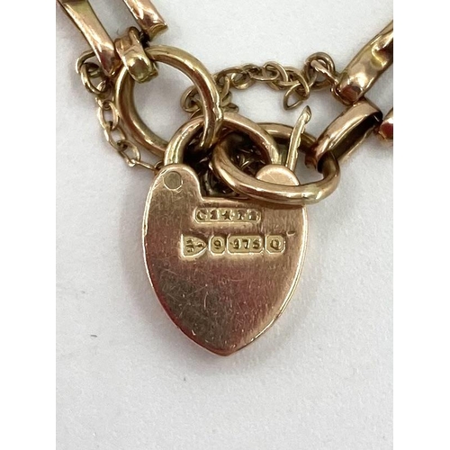 4 - A 9ct gold gate link bracelet, 8.4g with 9ct gold heart locket