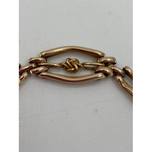 4 - A 9ct gold gate link bracelet, 8.4g with 9ct gold heart locket